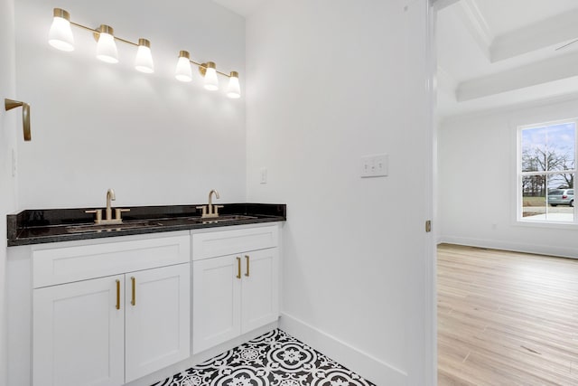 bathroom with vanity and hardwood / wood-style flooring