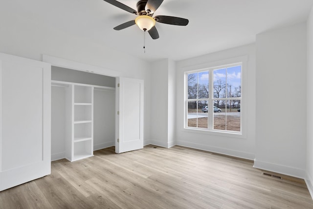 unfurnished bedroom featuring ceiling fan and light hardwood / wood-style flooring