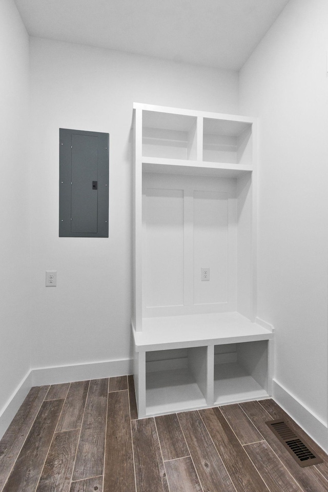 mudroom featuring electric panel and dark hardwood / wood-style floors