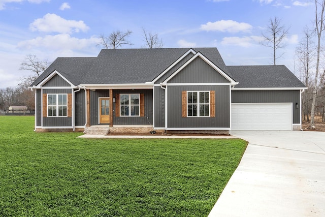 view of front of property with a front yard and a garage