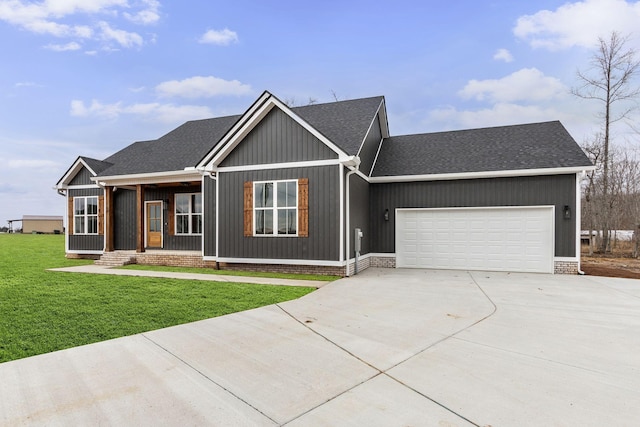 view of front facade with a garage and a front lawn