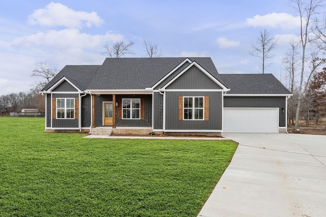 view of front of property with a porch, a garage, and a front lawn