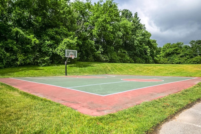 view of basketball court featuring a lawn