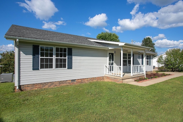 view of front facade with covered porch and a front yard