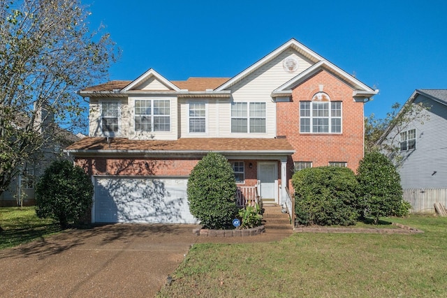 view of front of home featuring a front lawn and a garage