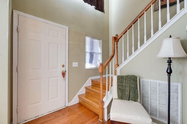 foyer entrance featuring hardwood / wood-style flooring