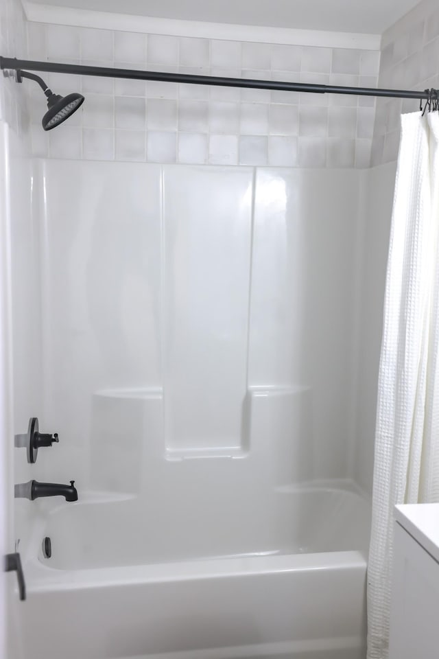 bathroom with shower / bath combination with curtain