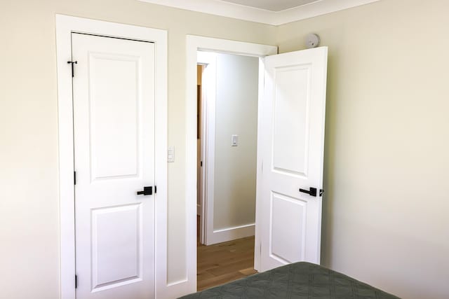 unfurnished bedroom featuring hardwood / wood-style flooring and a closet