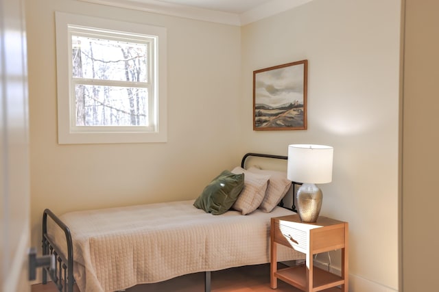 bedroom with ornamental molding