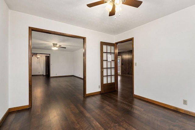 unfurnished room with ceiling fan, french doors, and dark hardwood / wood-style floors