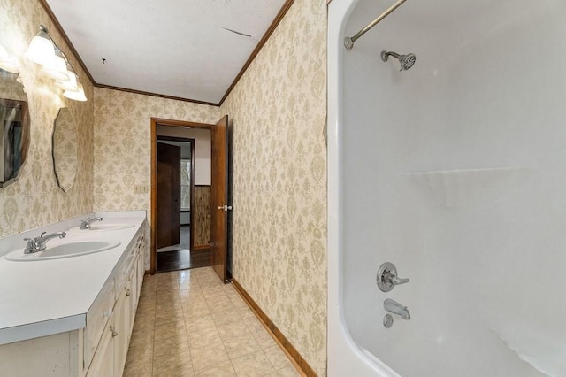 bathroom with ornamental molding, vanity, vaulted ceiling, washtub / shower combination, and tile patterned flooring