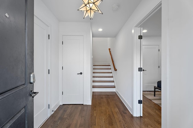 entrance foyer with dark hardwood / wood-style floors