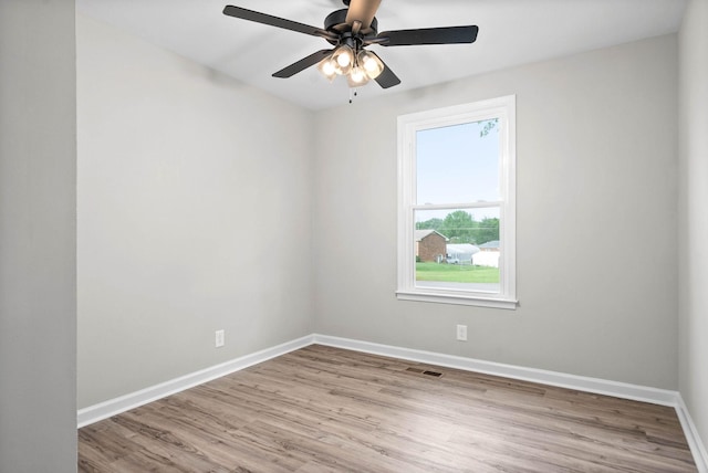 unfurnished room with ceiling fan and light hardwood / wood-style floors