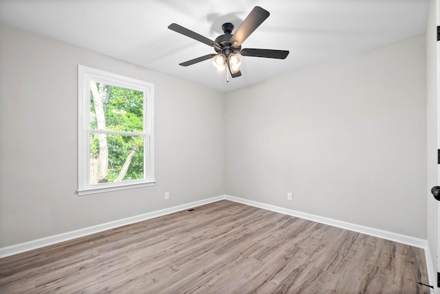 unfurnished room featuring ceiling fan and light hardwood / wood-style floors