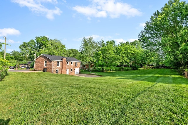 view of yard with a garage