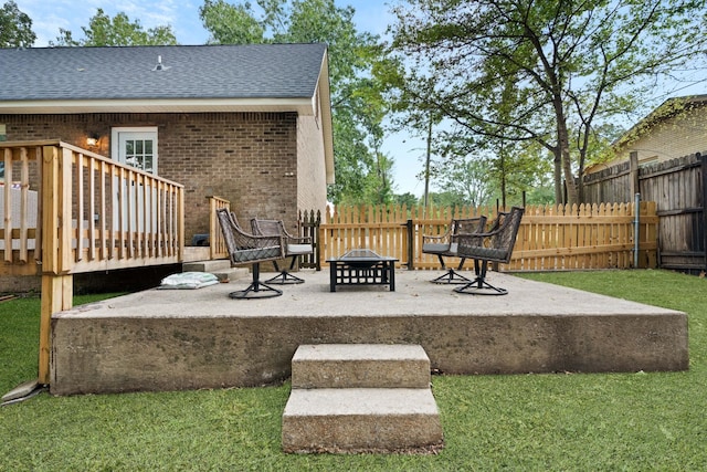 exterior space featuring a yard, a patio, and a fire pit