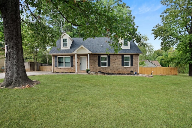 new england style home with a front lawn