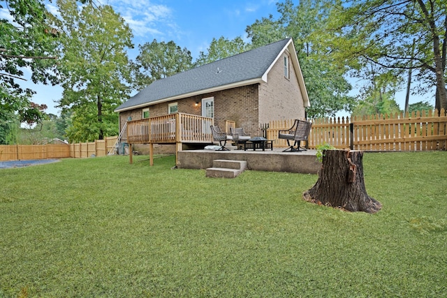 view of yard with a patio and a deck