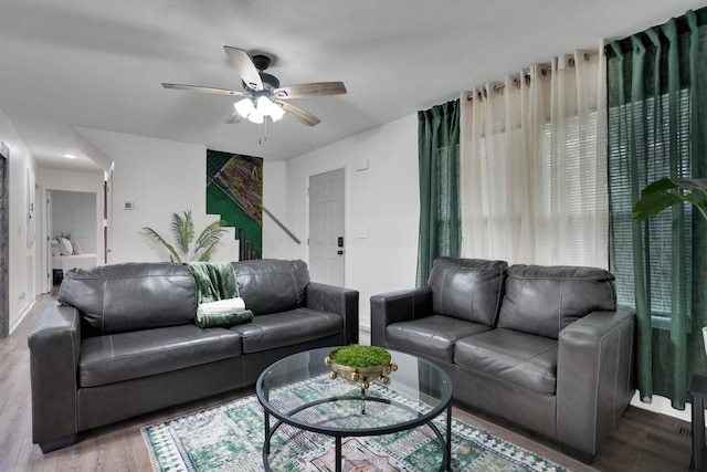 living room with hardwood / wood-style flooring and ceiling fan