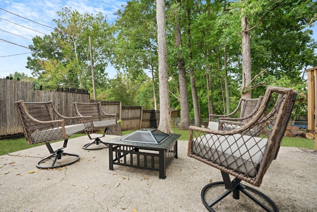 view of patio with a fire pit