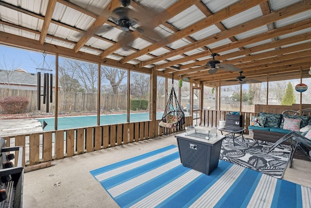 sunroom with ceiling fan and a healthy amount of sunlight