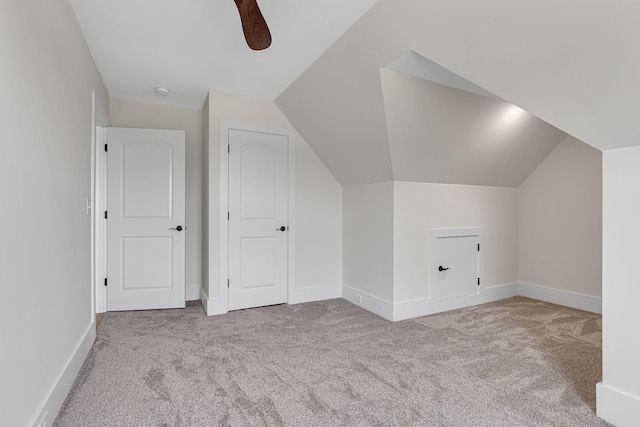 bonus room with ceiling fan, light colored carpet, and lofted ceiling