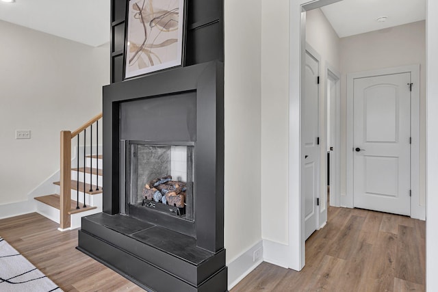 hallway featuring hardwood / wood-style flooring