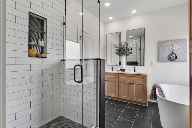 bathroom with tile patterned flooring, vanity, and independent shower and bath