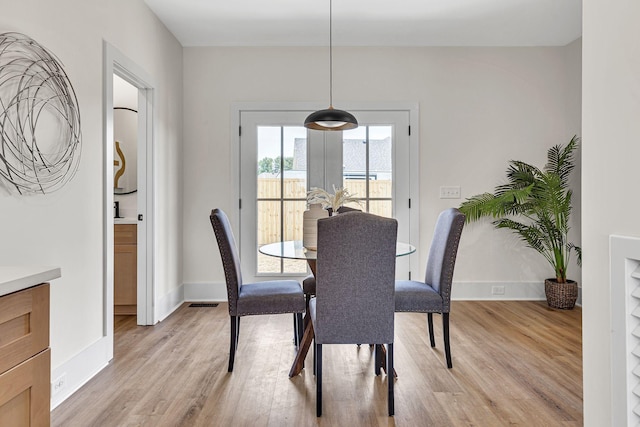 dining room with light wood-type flooring