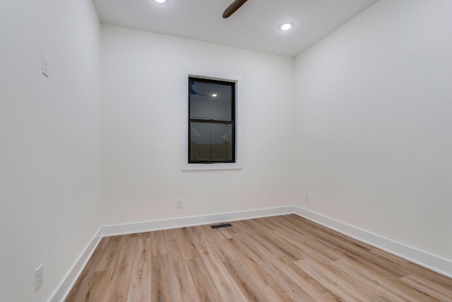 spare room featuring light wood-type flooring