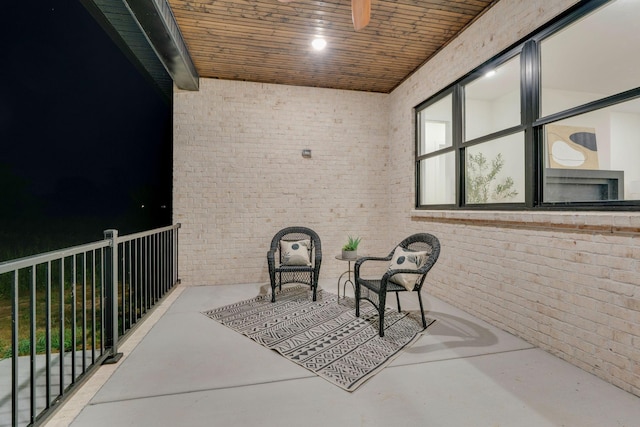 view of patio featuring ceiling fan and a balcony