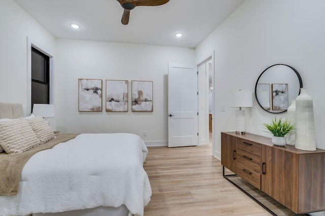 bedroom featuring light hardwood / wood-style floors and ceiling fan