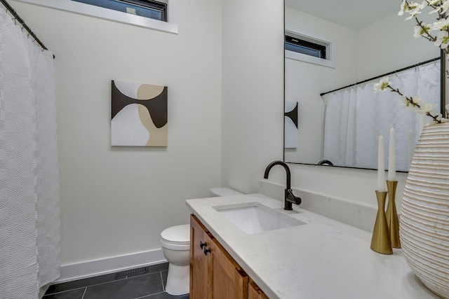 bathroom featuring tile patterned floors, vanity, and toilet