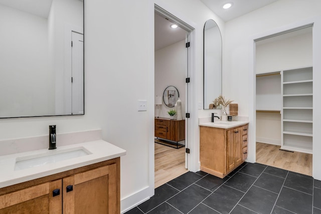 bathroom with tile patterned flooring and vanity