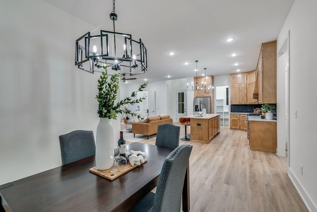 dining area with light hardwood / wood-style floors