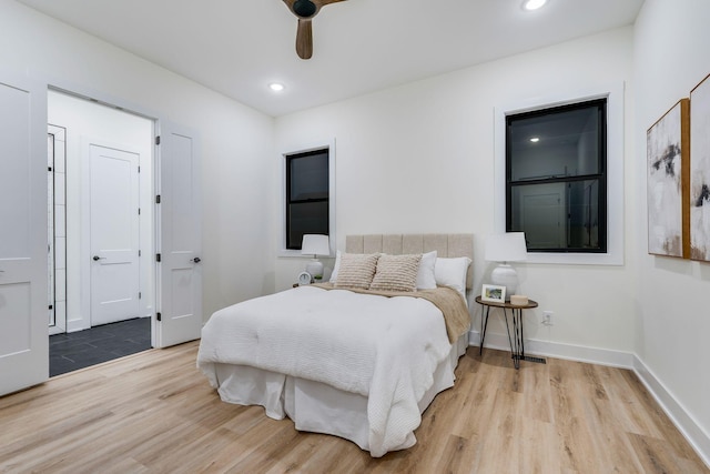 bedroom featuring light hardwood / wood-style floors and ceiling fan