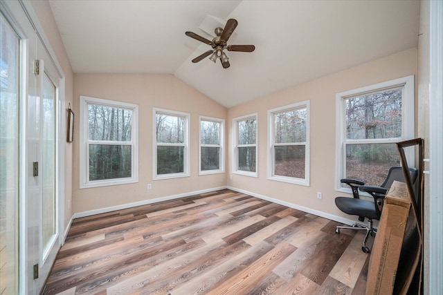 unfurnished office featuring wood-type flooring, vaulted ceiling, and ceiling fan