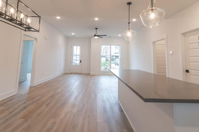 interior space with ceiling fan and hardwood / wood-style flooring