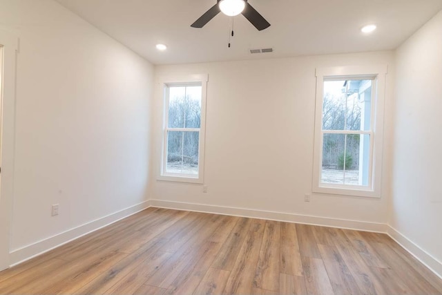 unfurnished room featuring ceiling fan and light hardwood / wood-style flooring