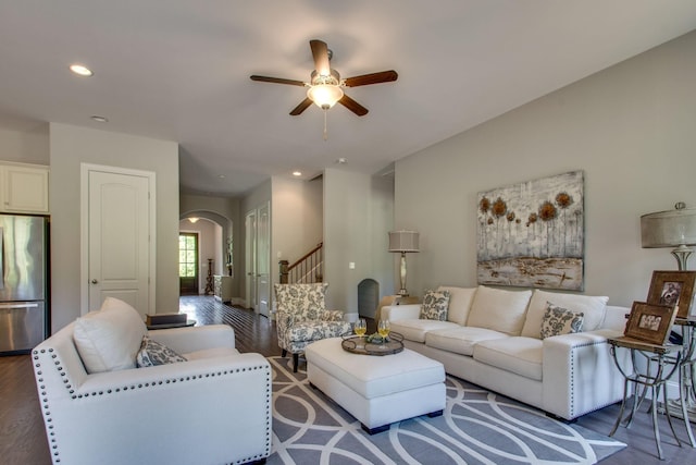 living room with ceiling fan and wood-type flooring