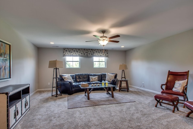 carpeted living room featuring ceiling fan