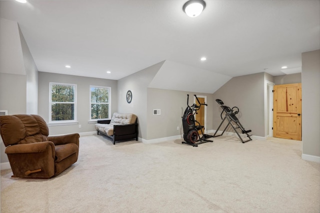 sitting room featuring carpet and lofted ceiling