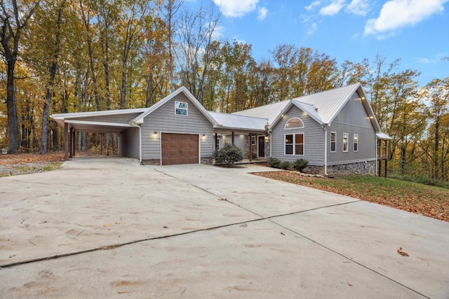 ranch-style home with a garage and a carport