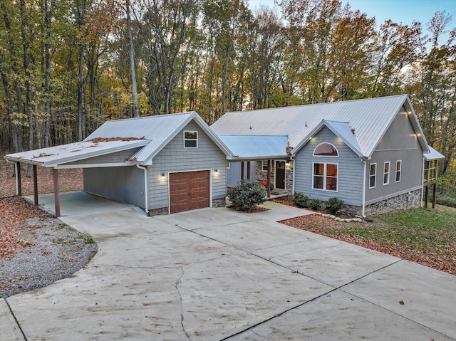 ranch-style house with a garage and a carport