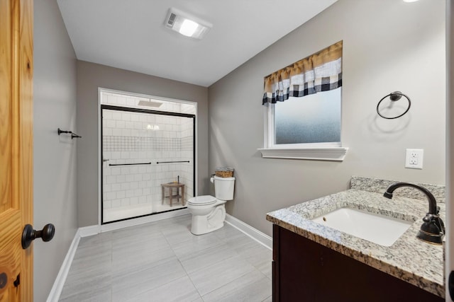 bathroom featuring a shower, tile patterned flooring, vanity, and toilet