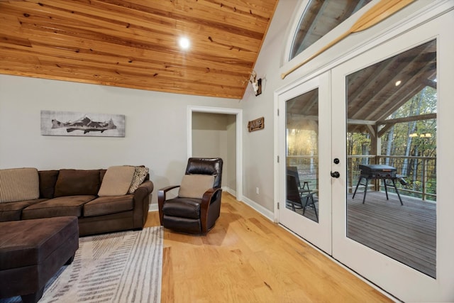 living room with vaulted ceiling, wooden ceiling, light hardwood / wood-style flooring, and french doors