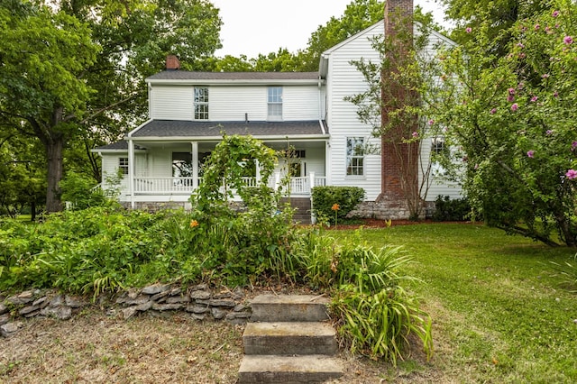 view of front of home with a front lawn and covered porch