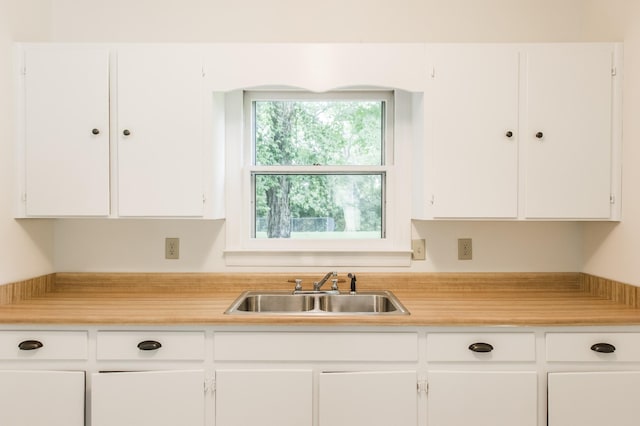 kitchen with white cabinets and sink