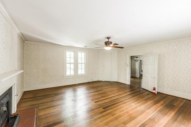 unfurnished living room with crown molding, ceiling fan, and dark wood-type flooring