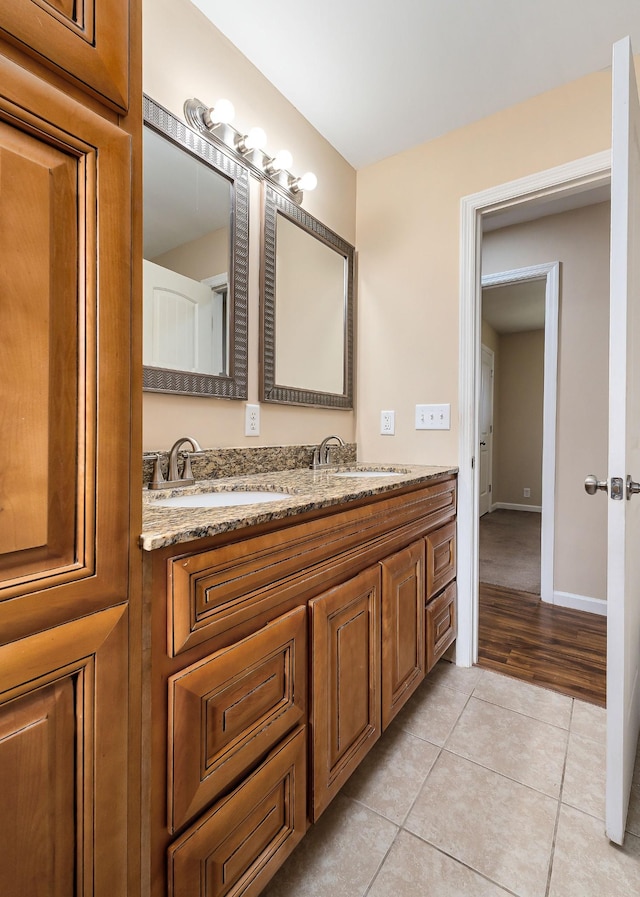 bathroom with tile patterned flooring and vanity